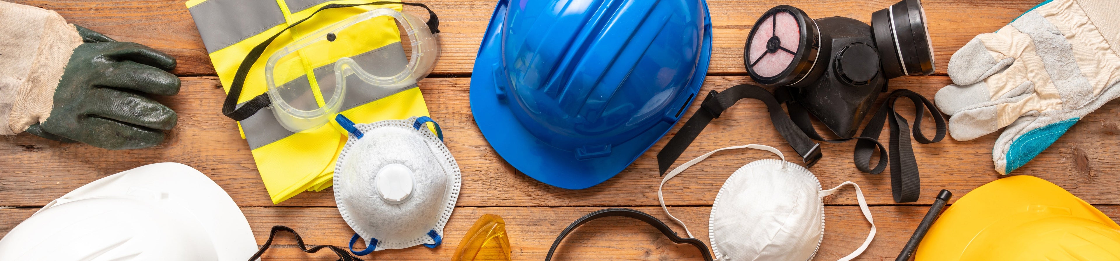 Collection of safety and packaging supplies including helmets, masks, and gloves